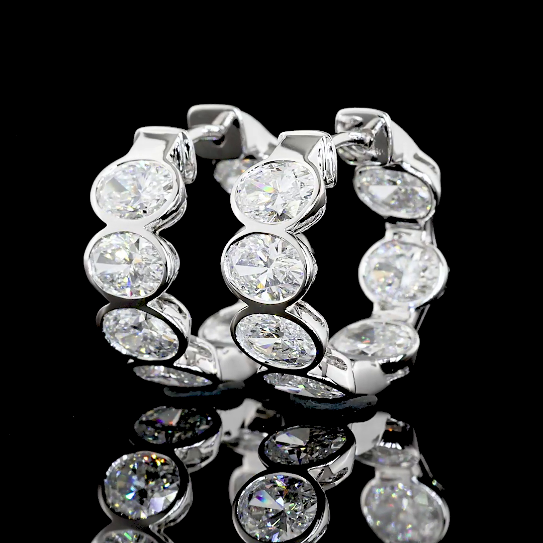 14K Oval Cut Bezel Mini Hoops | Restivo Jewelers